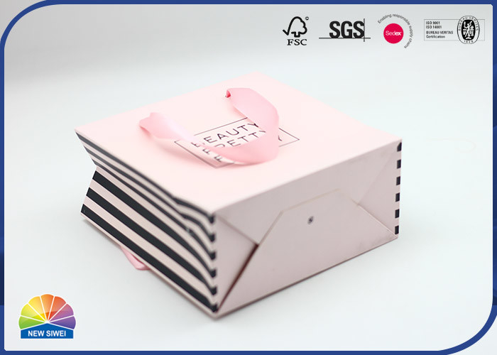 El regalo que hace compras de papel impreso de lujo del color de encargo empaqueta con las cuerdas de nylon de la manija